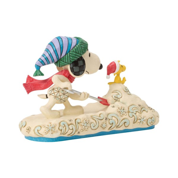 Snoopy schaufelt Schnee mit Woodstock – Erdnüsse