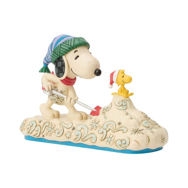 Snoopy schaufelt Schnee mit Woodstock – Erdnüsse